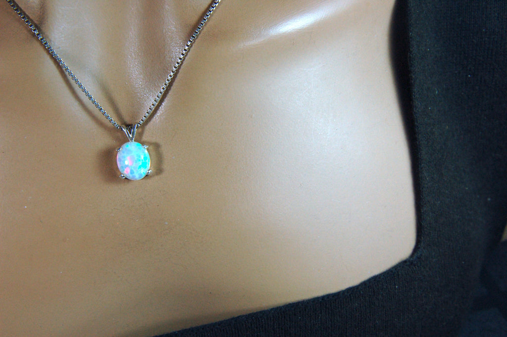 Opal pendant.Bright rolling colors. Desirable honeycomb gemstone.Perfect gift for her.MUST see colors in video.121213
