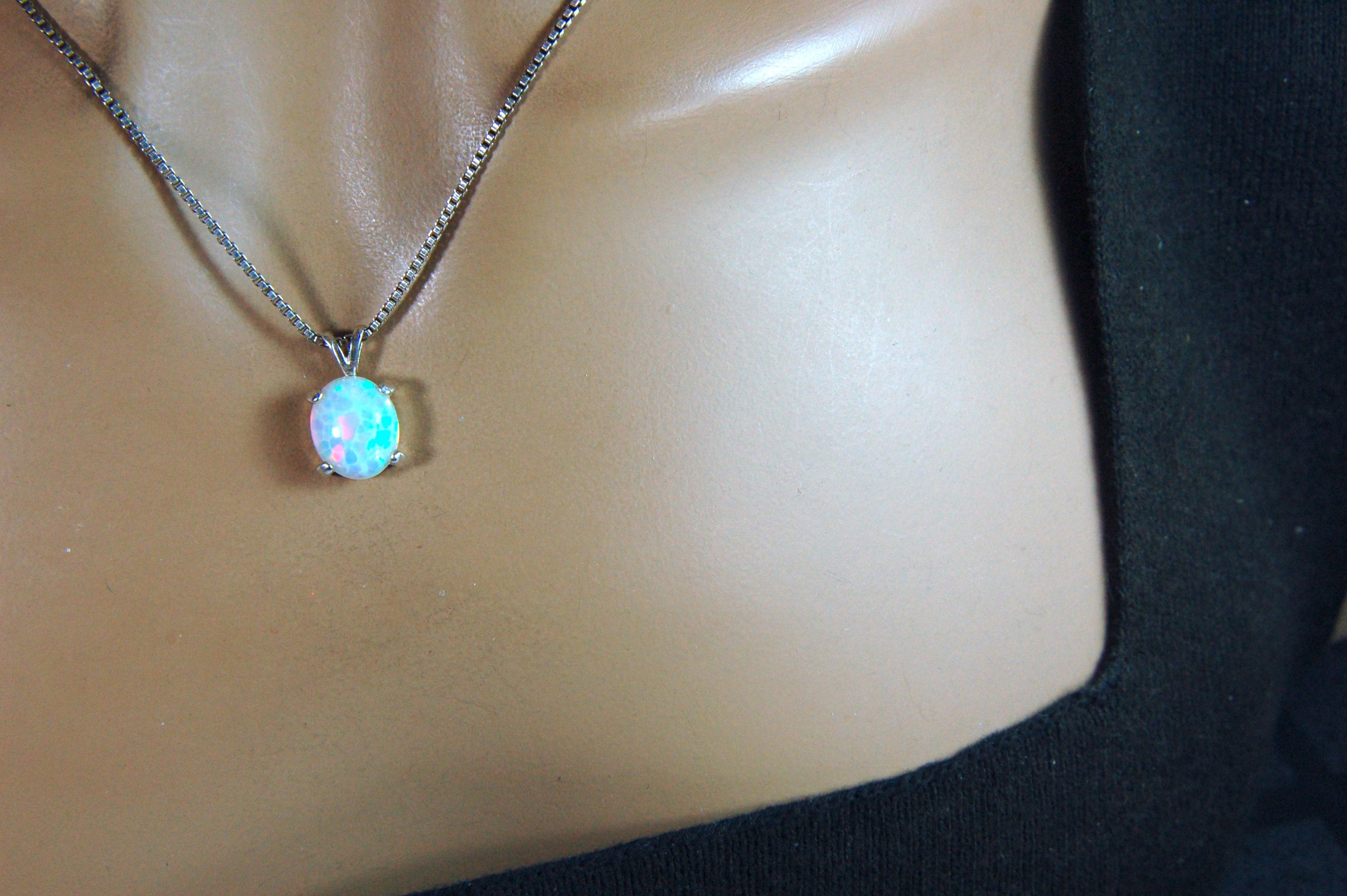 Opal pendant.Bright rolling colors. Desirable honeycomb gemstone.Perfect gift for her.MUST see colors in video.121213
