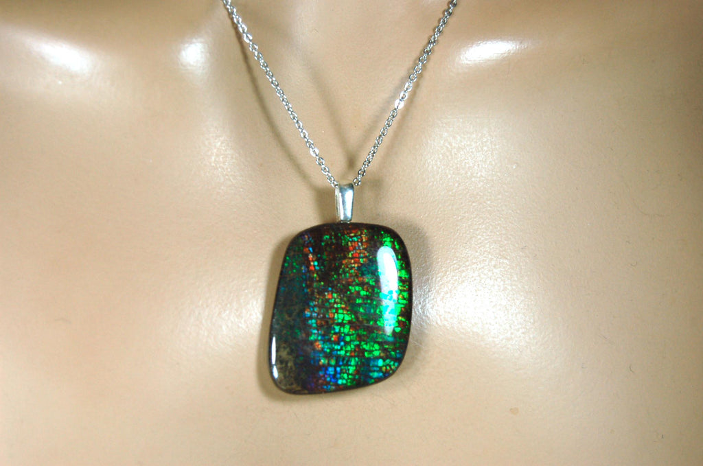 Ammolite Pendant Necklace.RARE Natural gem with brilliant sparks of color on black background.--071815