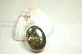 Ammolite Pendant.Rare sparks of color.Looks like a black Opal.One of a kind gem.Rare gift for her.Sterling Silver setting.022316
