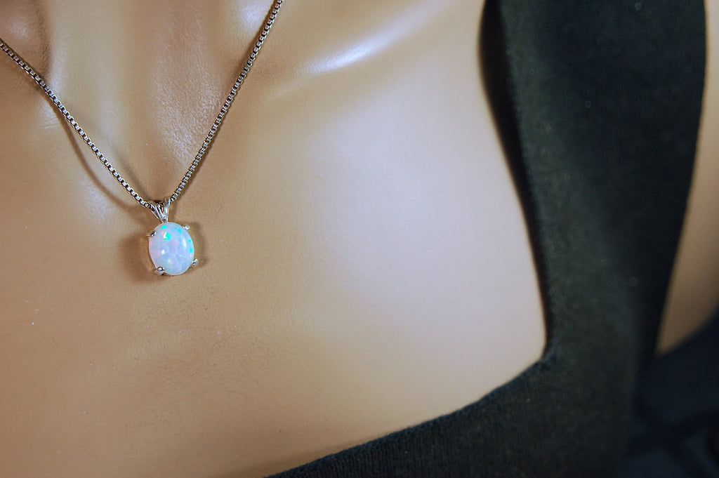 Opal pendant.Bright rolling colors. Desirable honeycomb gemstone.Perfect gift for her.MUST see colors in video.121213