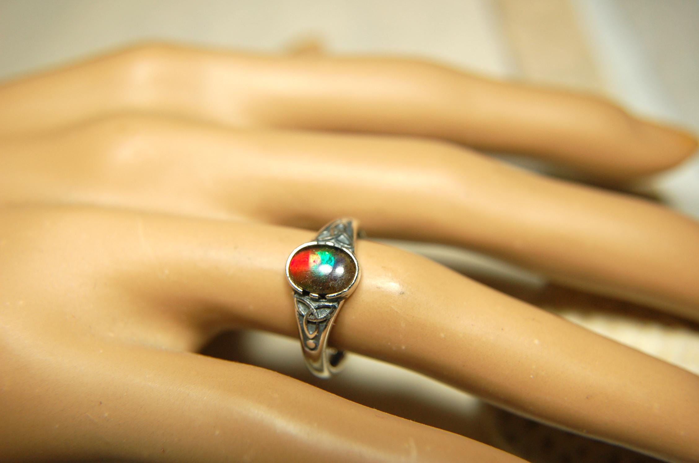 Ammolite Ladies Ring.Sterling Silver.Very feminine, has Celtic design and is in your size too!Brilliant tricolor gem.Gift for her?030816