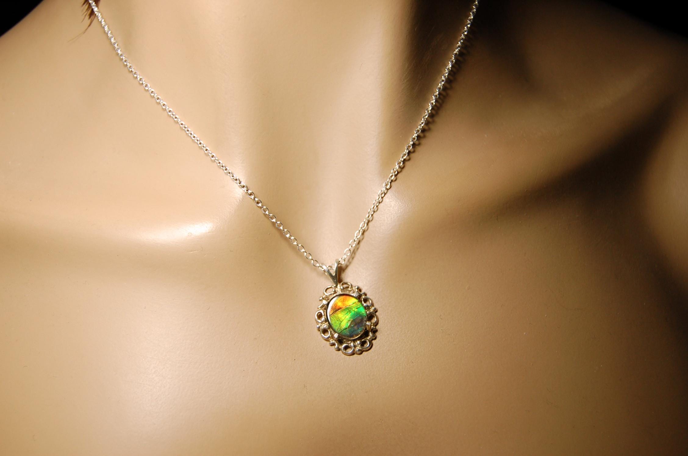 Ammolite Pendant from Alberta Canada.Genuine quality ammolite with warranty.The perfect gift.010926