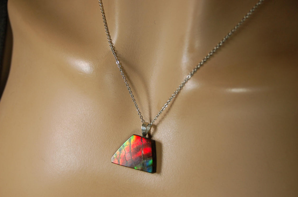 Natural Ammolite pendant with natural cabochon gem mined in Alberta Canada.070915