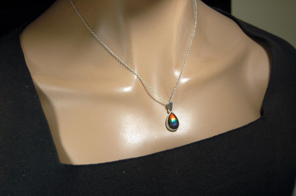 Dainty ammolite pendant.Brilliant color gem.Feminine jewelry.UniqueGift for her.Canadian gemstone.Sterling Silver setting.021126