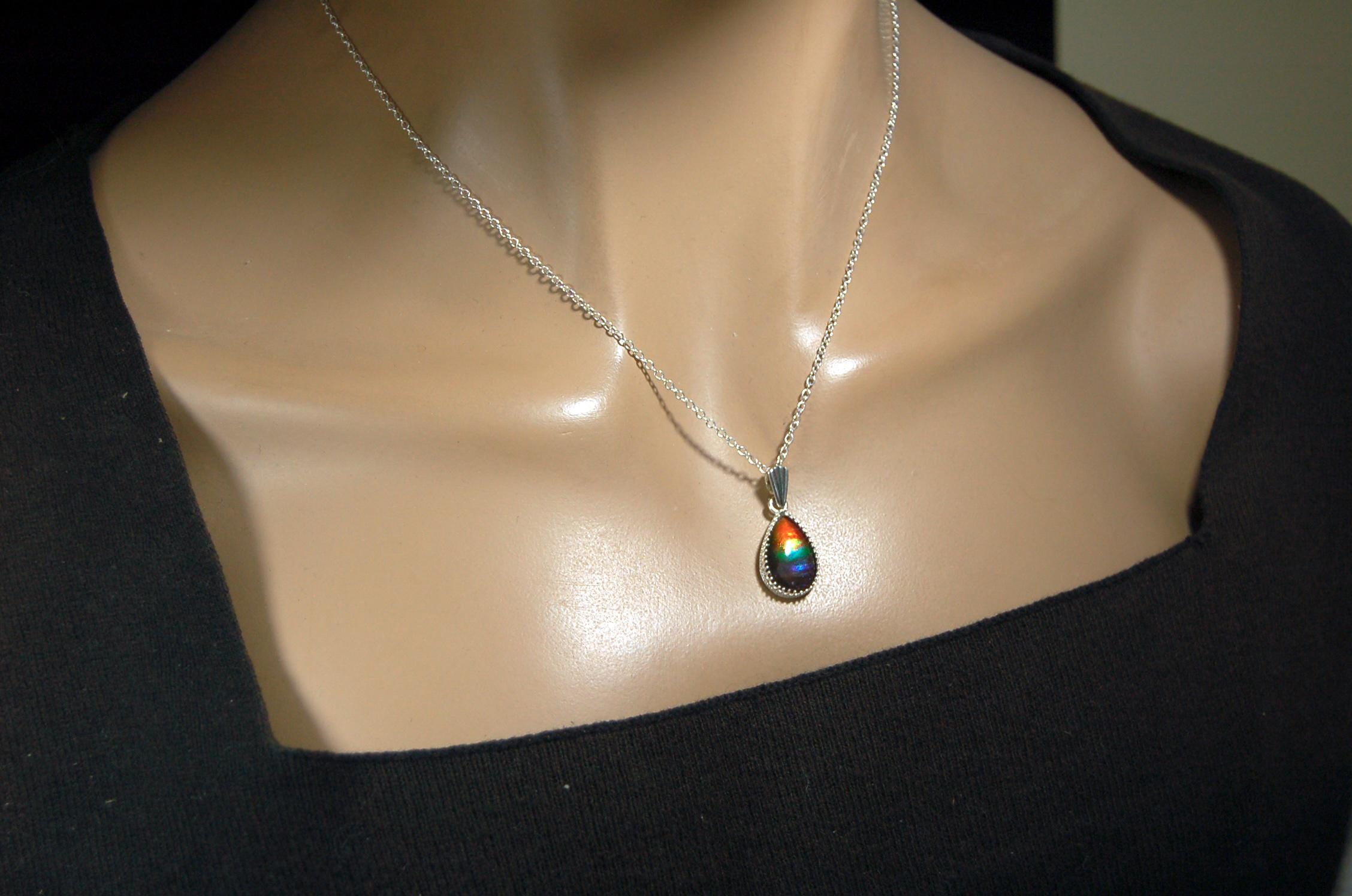 Dainty ammolite pendant.Brilliant color gem.Feminine jewelry.UniqueGift for her.Canadian gemstone.Sterling Silver setting.021126