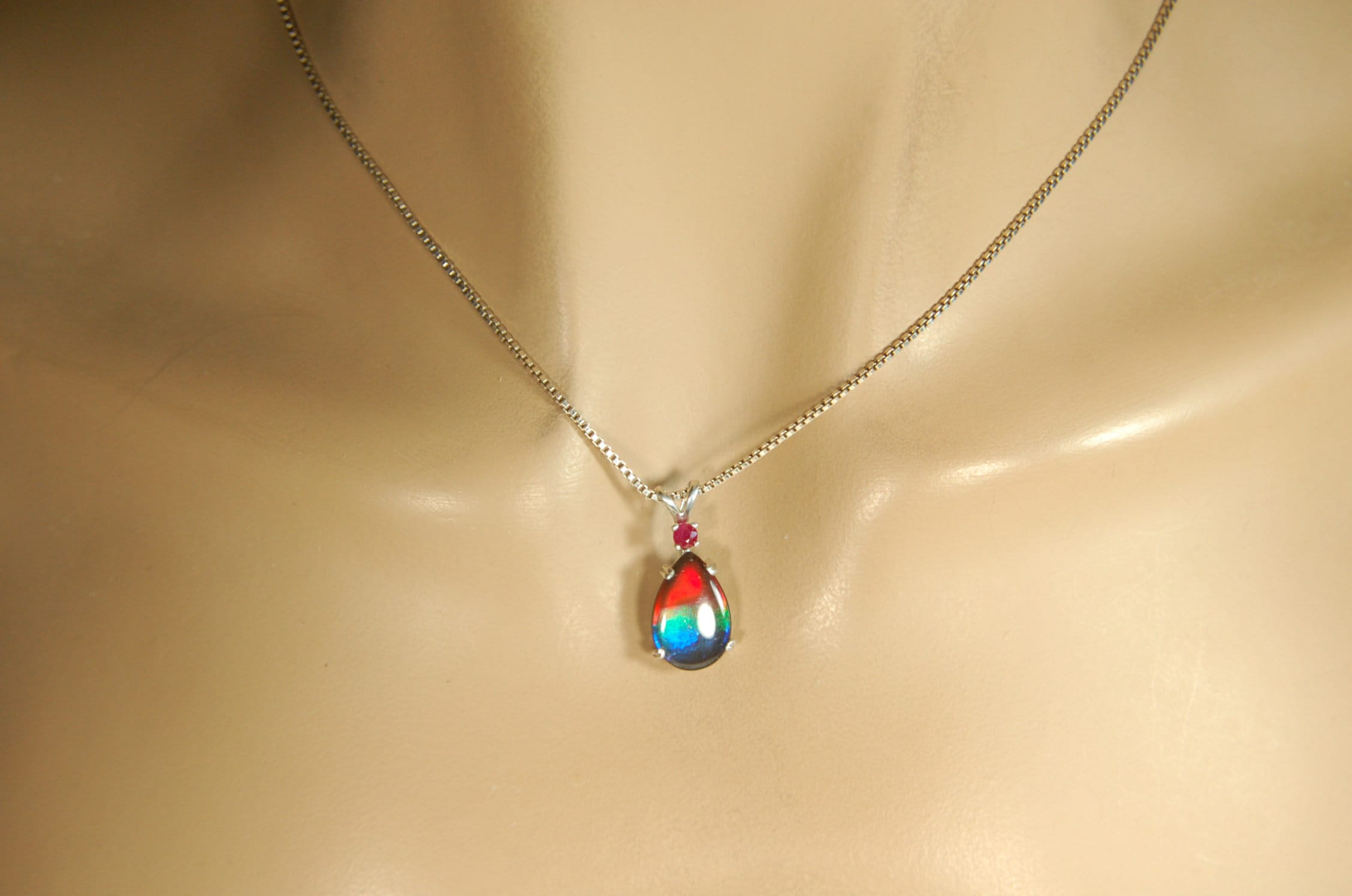 Ammolite Raibow pendant.Natural ruby companion stone.Lots of bright colors.#110317