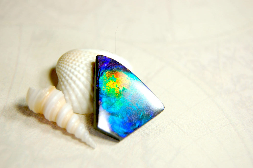 Natural Ammolite Cabochon.Certified Canadian Gem.Rare blues.Will make a valuable one of a kind pendant.A perfect gift.