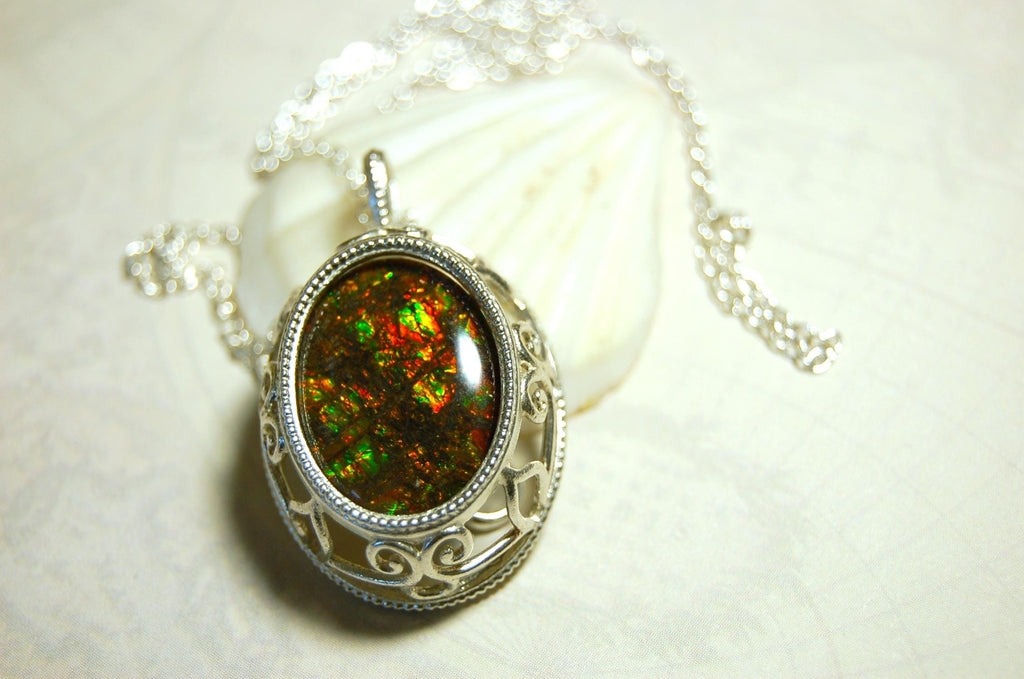 Unusual Ammolite pendant full of multicolor sparkles.A gift that will be treasured..032116