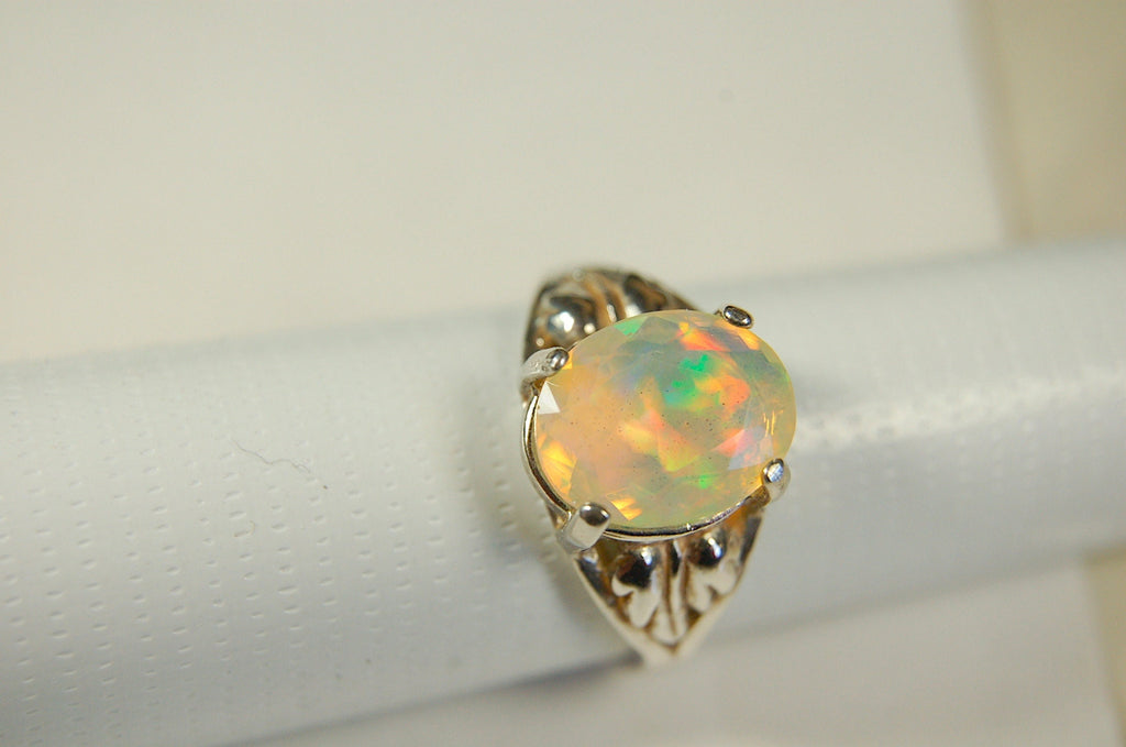 Opal ring.Bright Faceted Natural gem.Lovely flashing colors.#102612