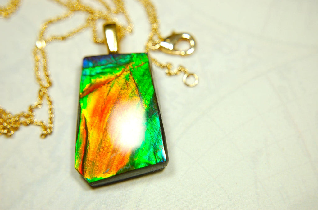 Ammolite pendant.Vivid colors in a high quality all natural cabochon with 14k gold filled bail.Fine fashion jewelry accessory 022516