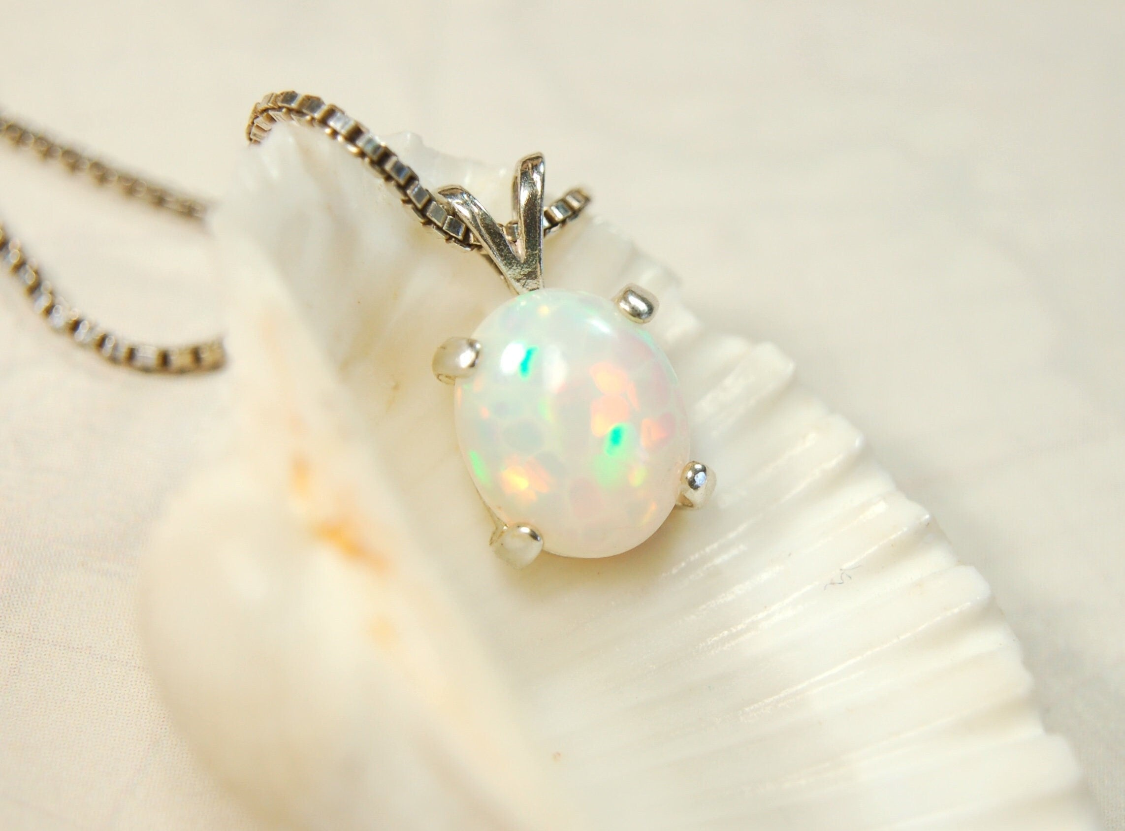 Opal pendant.Bright rolling colors. Desirable honeycomb gemstone.Perfect gift for her.MUST see colors in video.121213