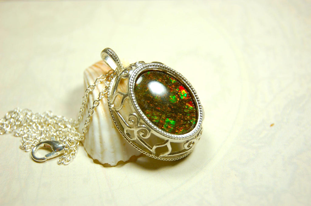 Unusual Ammolite pendant full of multicolor sparkles.A gift that will be treasured..032116