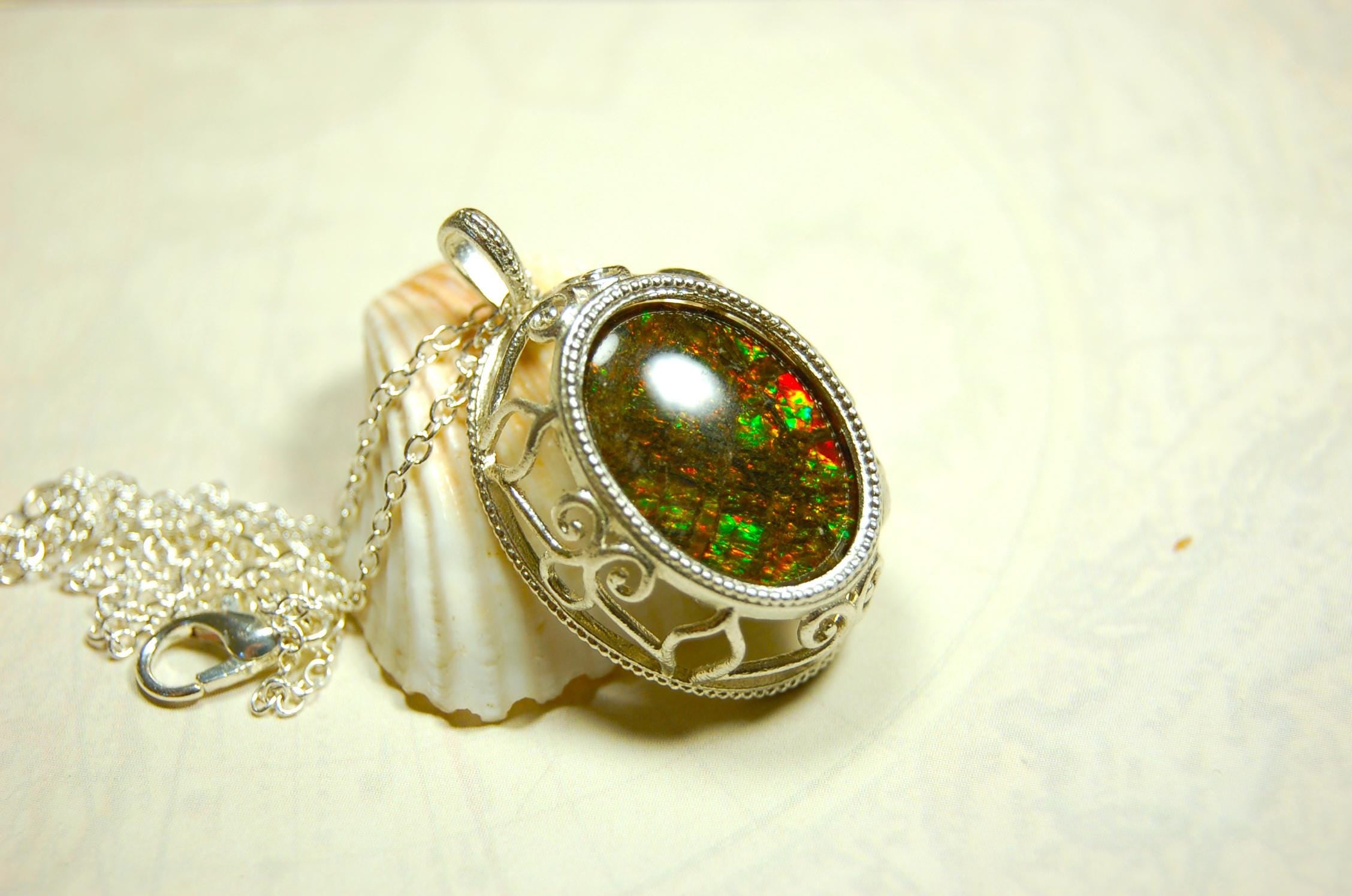 Unusual Ammolite pendant full of multicolor sparkles.A gift that will be treasured..032116