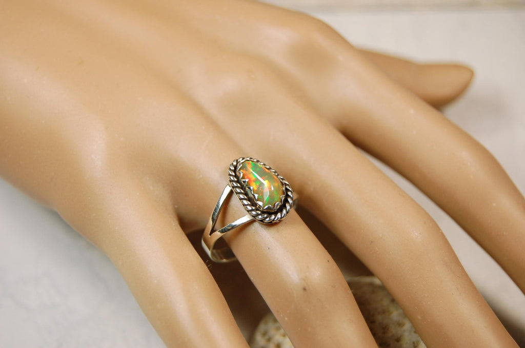 Opal Ring.Genuine untreated Ethiopian Opal.Lovely bright colors when rotated.Size 8.Sterling Silver.053115
