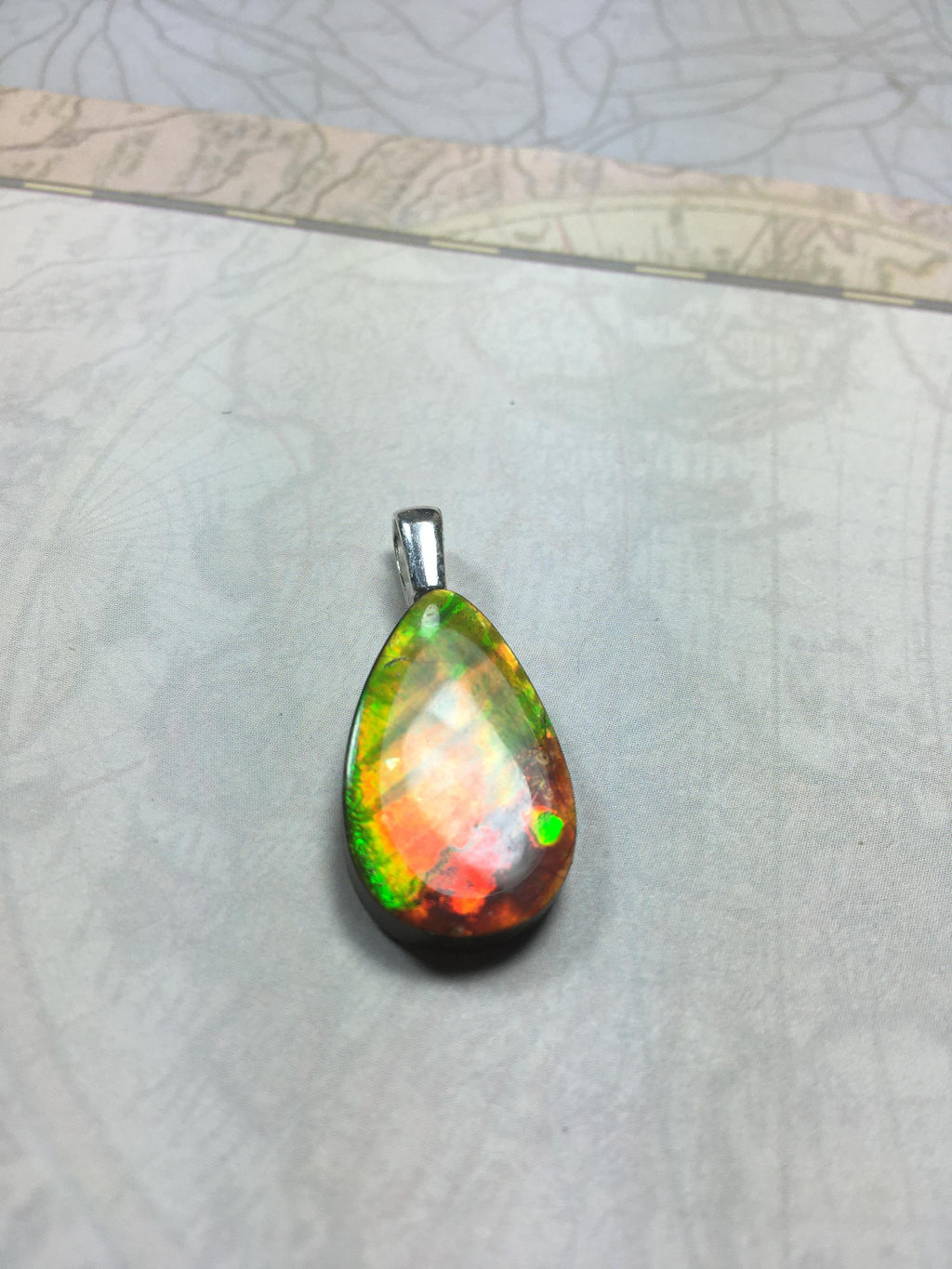 Anniversary gift idea.Unisex Jewelry.Ammolite Pendant Necklace, Sterling Silver Feather Bail. Color changing natural freeform cabochon.