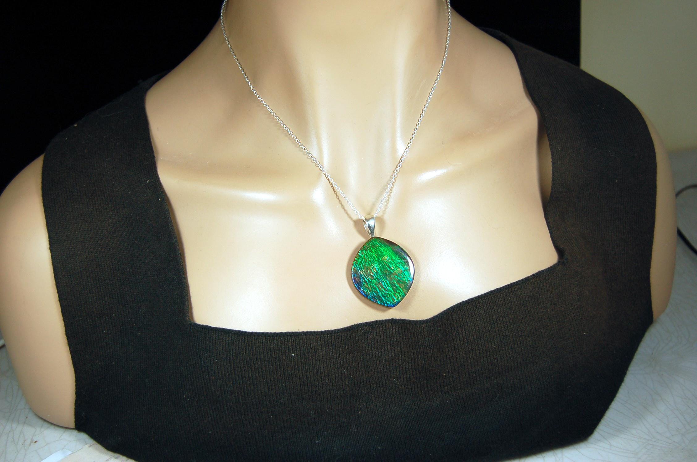 Ammolite pendant for lovers of green this is the one.High quality genuine gem from Alberta Canada.Big impact pendant.021226