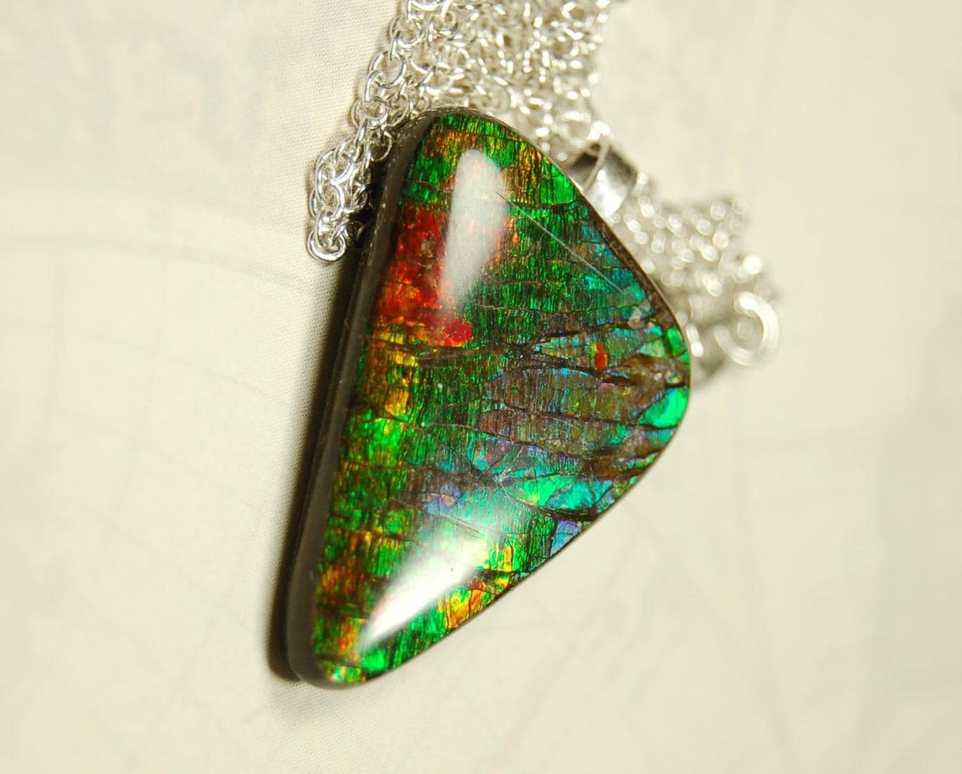 Natural Ammolite Gemstone Pendant from Alberta Canada with bright rich varied colors. A perfect Unisex  birthday gift. 032416