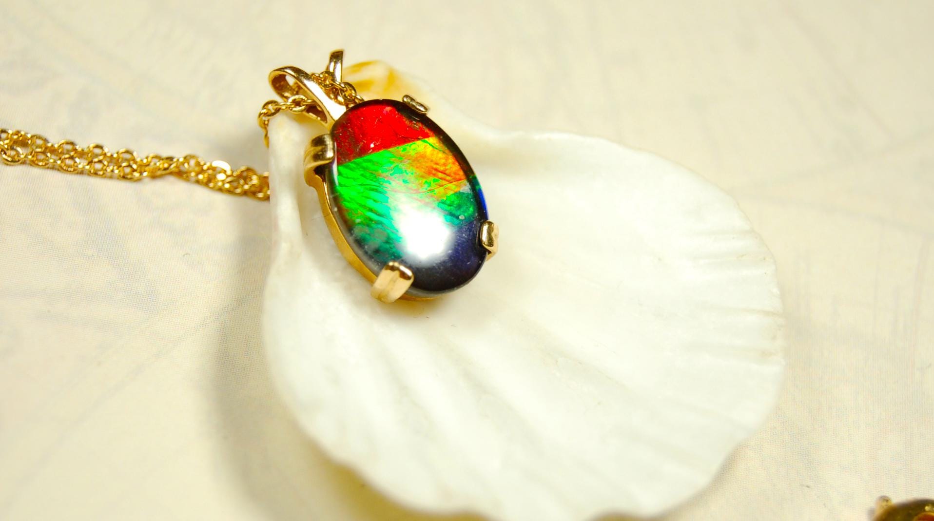 Ammolite necklace pendant in solid 10k yellow gold.A gift your wife will treasure.Brilliant color changer. 071601