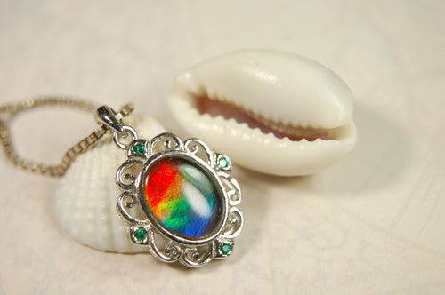 Ammolite Jewelry Pendant.Certified Authentic Canadian gem.White Gold Fill over Sterling silver setting.120213