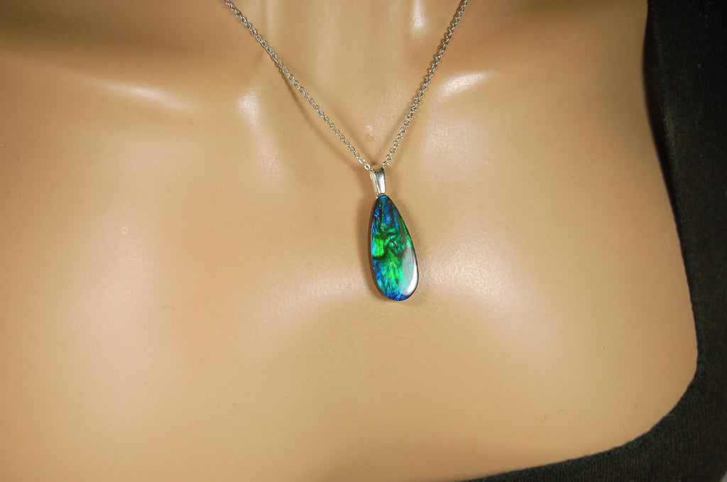 Ammolite Jewelry Pendant.All natural high quality cabochon from Alberta Canada.070715