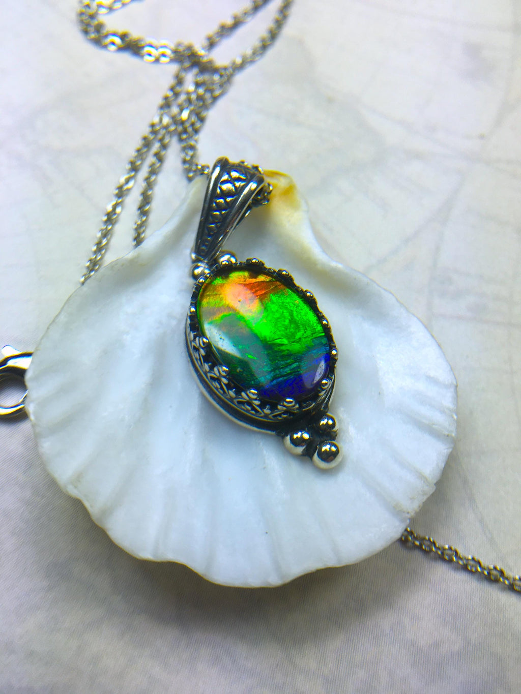 Genuine Ammolite Jewelry Pendant.Rainbow gem.Sterling Silver setting.No import taxes under CUSMA rules.062815