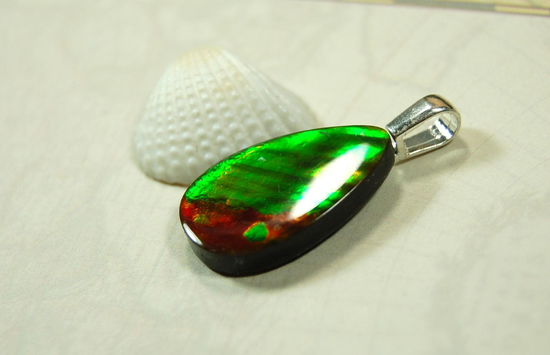 Anniversary gift idea.Unisex Jewelry.Ammolite Pendant Necklace, Sterling Silver Feather Bail. Color changing natural freeform cabochon.