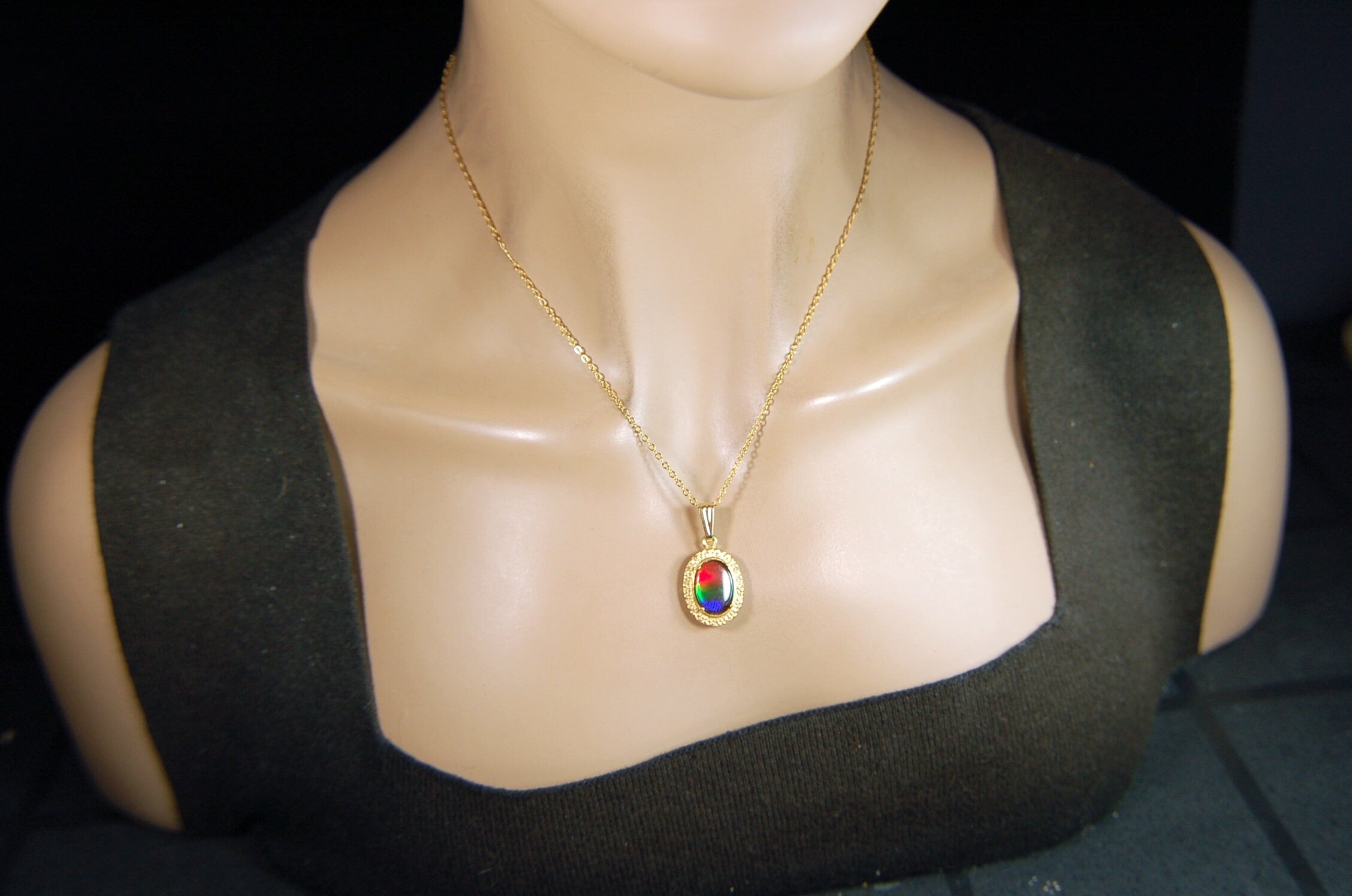Genuine rainbow Ammolite pendant in 14k gold fill setting.#070414