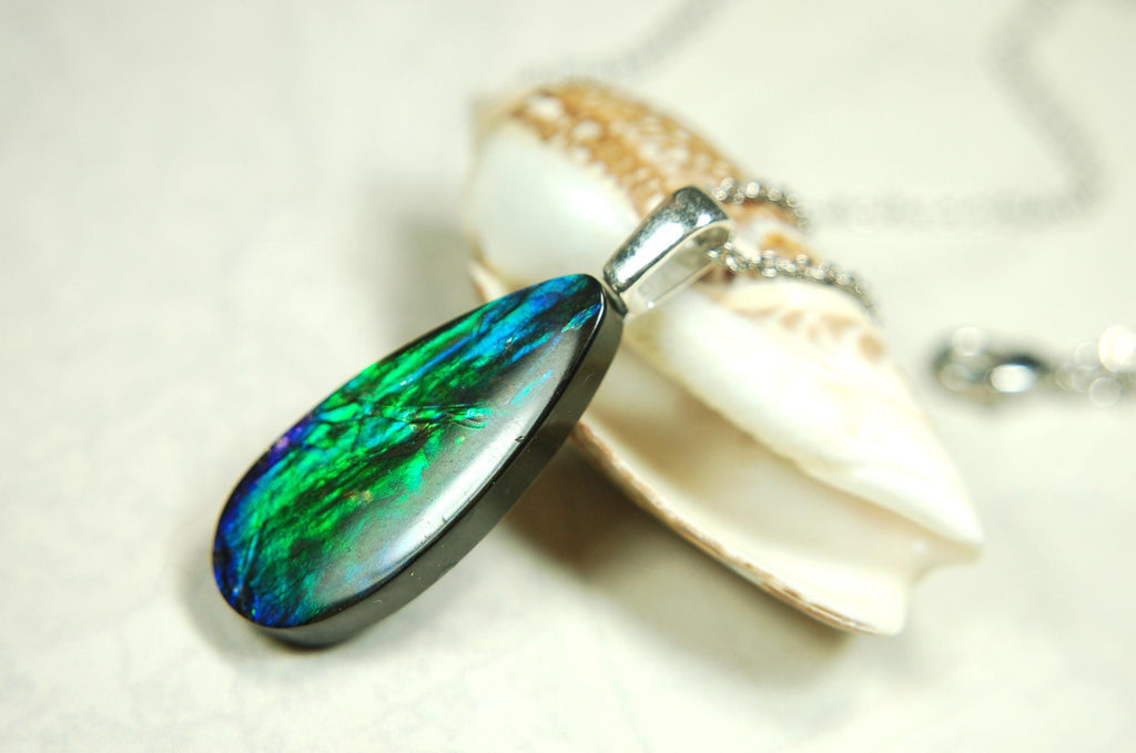 Ammolite Jewelry Pendant.All natural high quality cabochon from Alberta Canada.070715