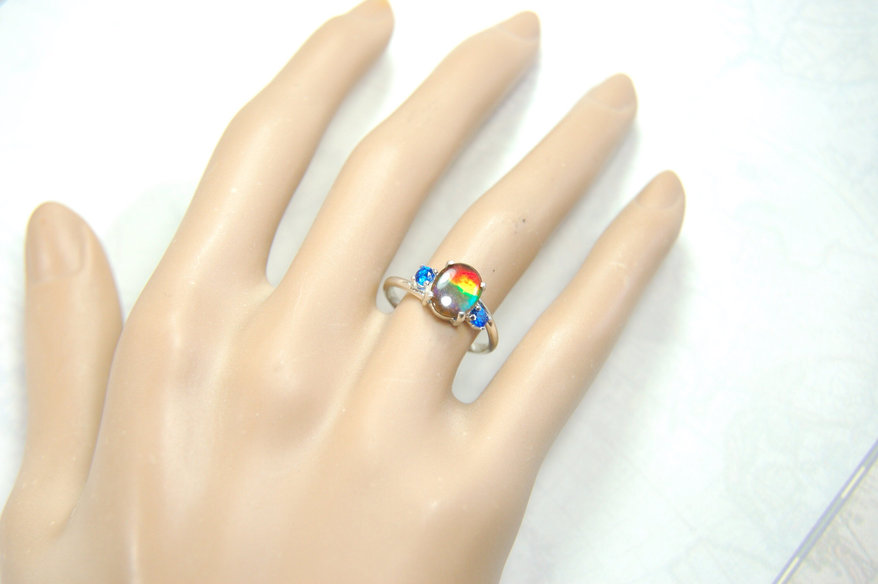 Ammolite Ring with brilliant Spinel side stones.Size 7.