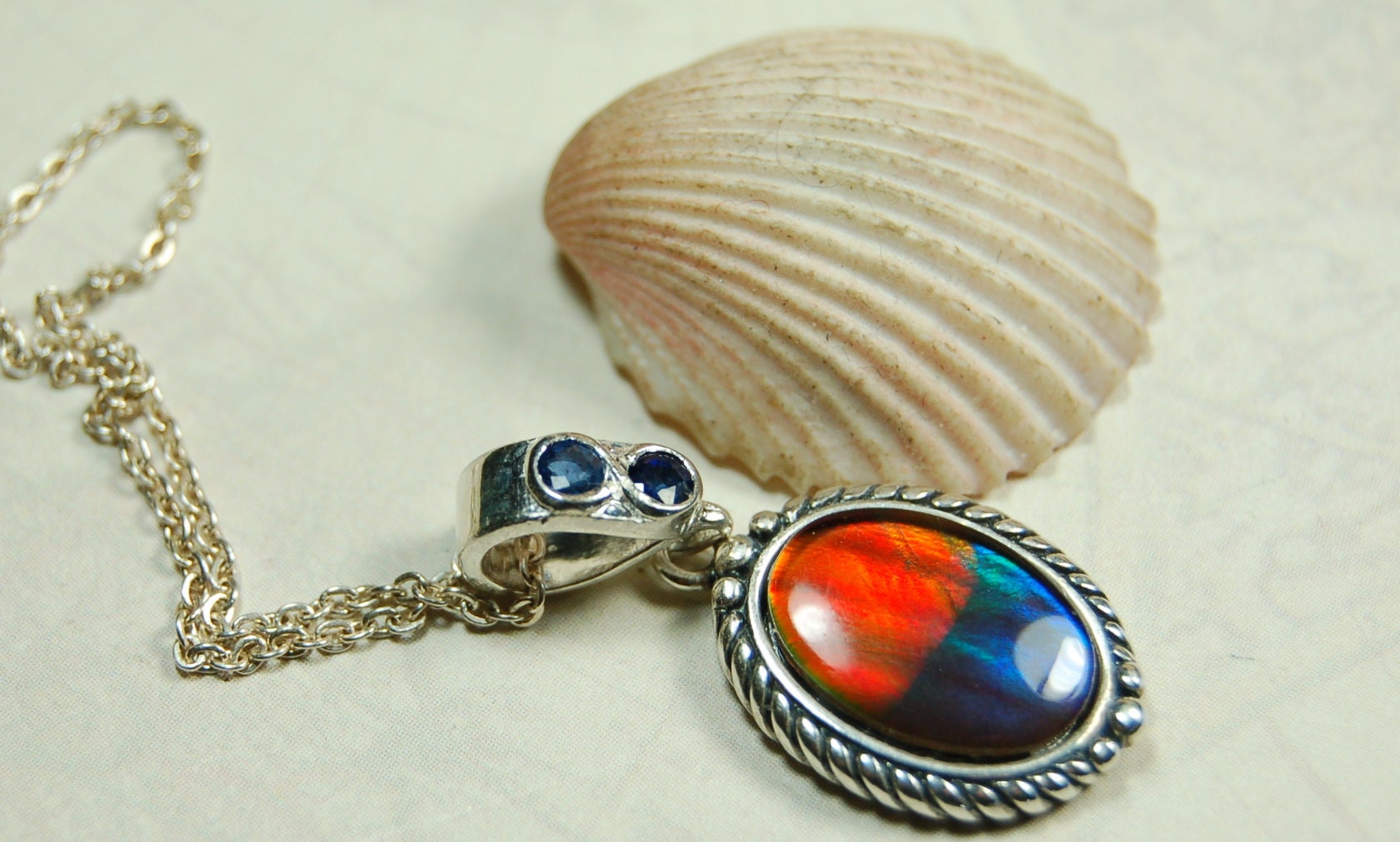 Ammolite Pendant Necklace.Solid sterling silver setting.Bright Rainbow colors. Sapphire studded bail.Unique gift for wife.102429