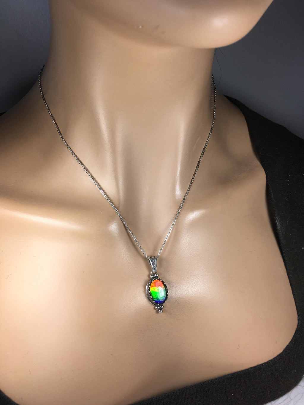 Genuine Ammolite Jewelry Pendant.Rainbow gem.Sterling Silver setting.No import taxes under CUSMA rules.062815