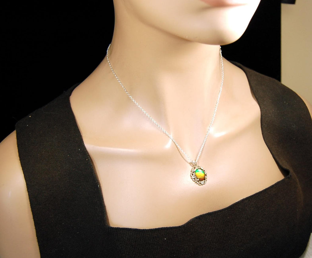 Ammolite pendant petite but powerful impact.Rich Sunset colors.Memorable gift.Fashion accessory.Rare jewelry.022216