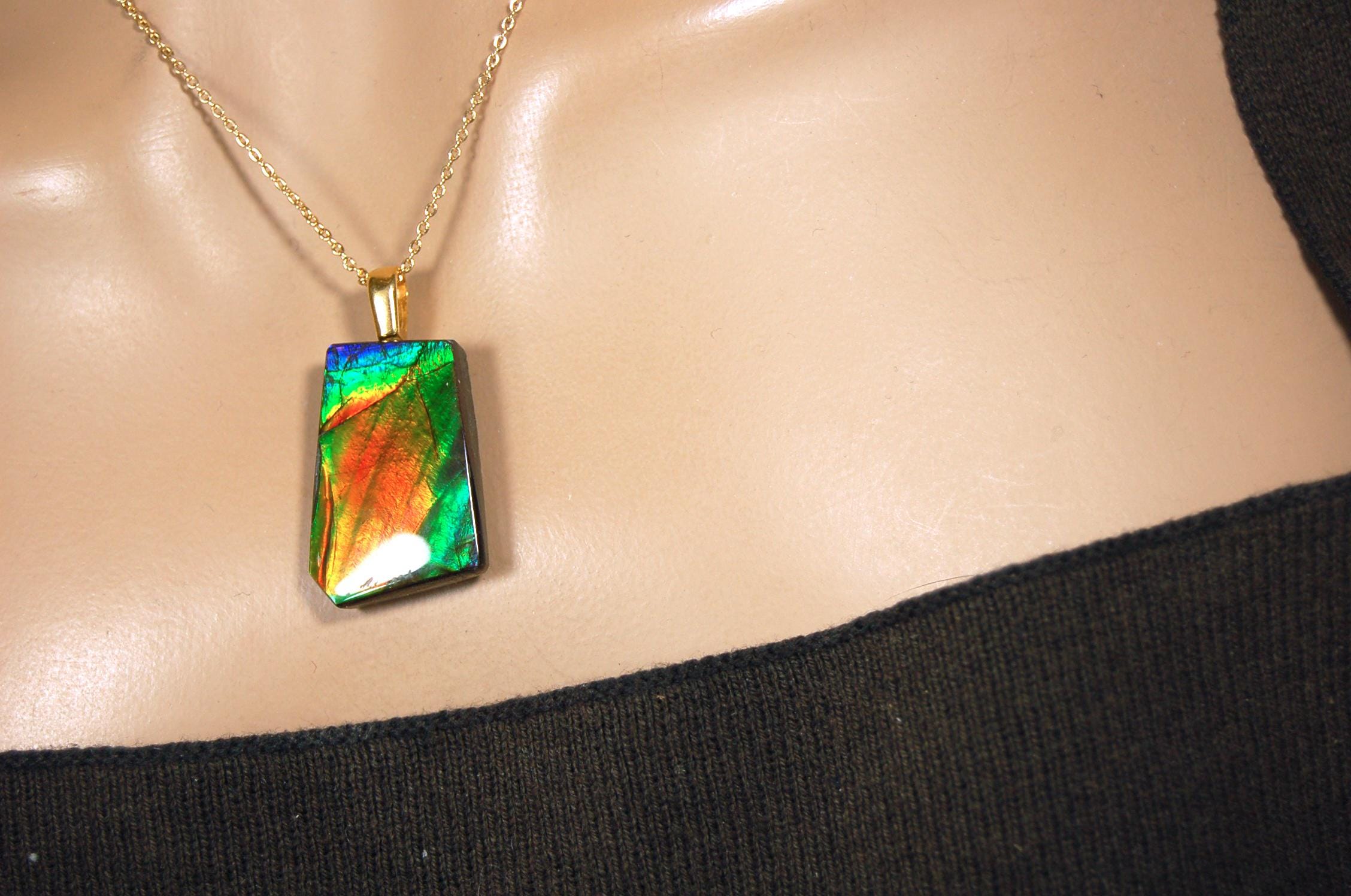 Ammolite pendant.Vivid colors in a high quality all natural cabochon with 14k gold filled bail.Fine fashion jewelry accessory 022516