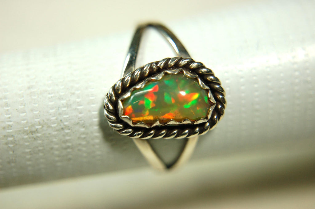 Opal Ring.Genuine untreated Ethiopian Opal.Lovely bright colors when rotated.Size 8.Sterling Silver.053115
