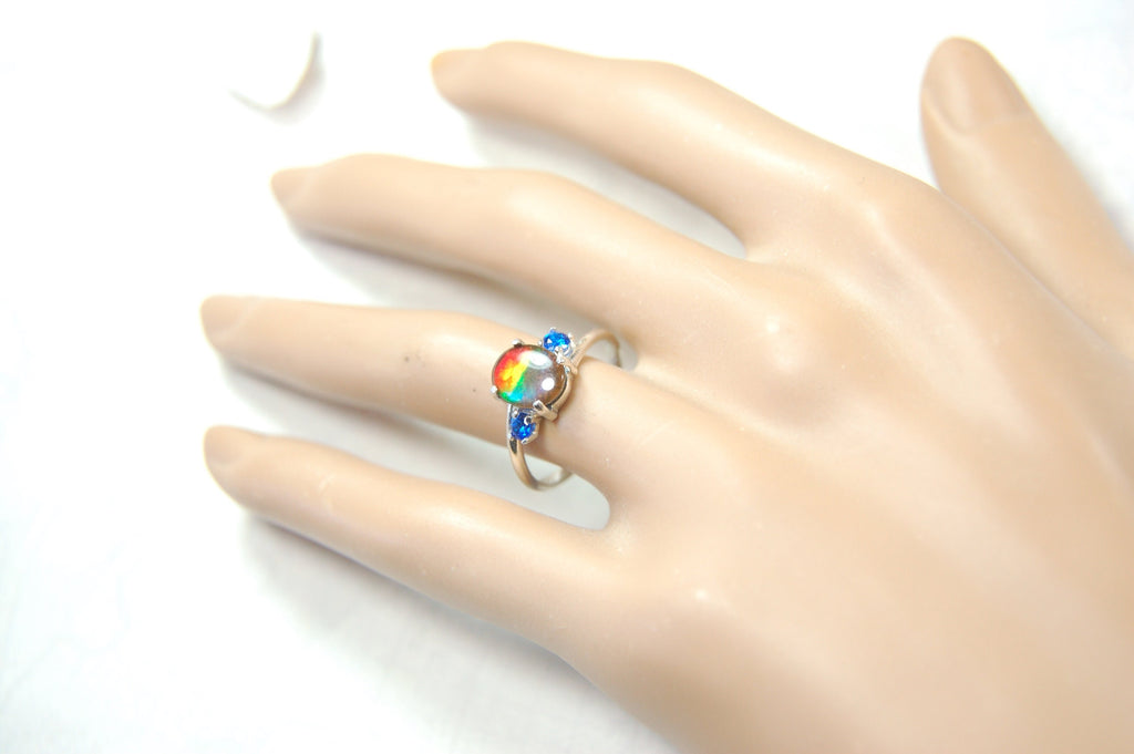 Ammolite Ring with brilliant Spinel side stones.Size 7.