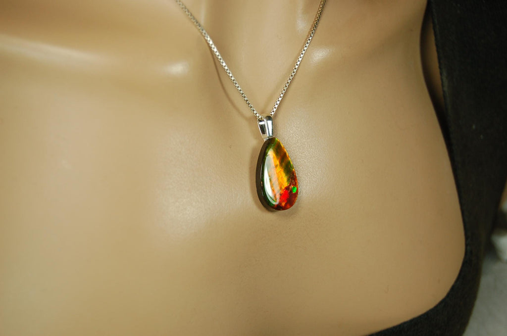 Anniversary gift idea.Unisex Jewelry.Ammolite Pendant Necklace, Sterling Silver Feather Bail. Color changing natural freeform cabochon.