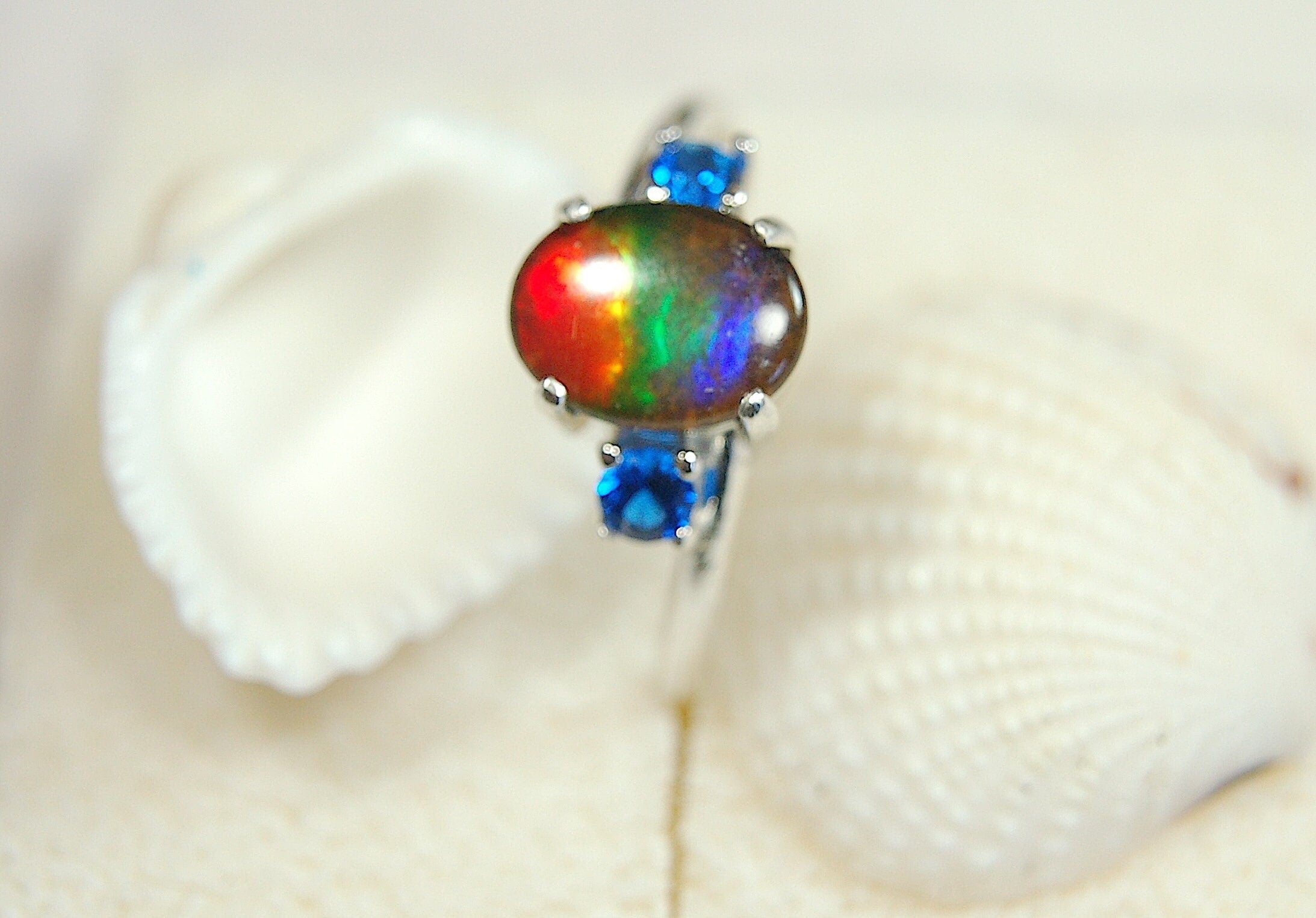 Ammolite Ring with brilliant Spinel side stones.Size 7.