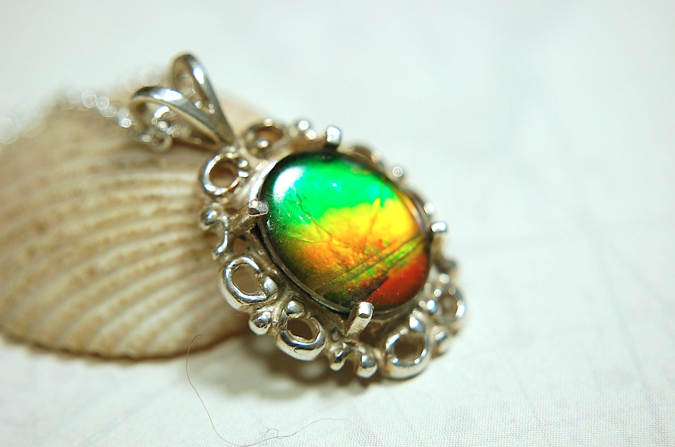 Ammolite pendant petite but powerful impact.Rich Sunset colors.Memorable gift.Fashion accessory.Rare jewelry.022216
