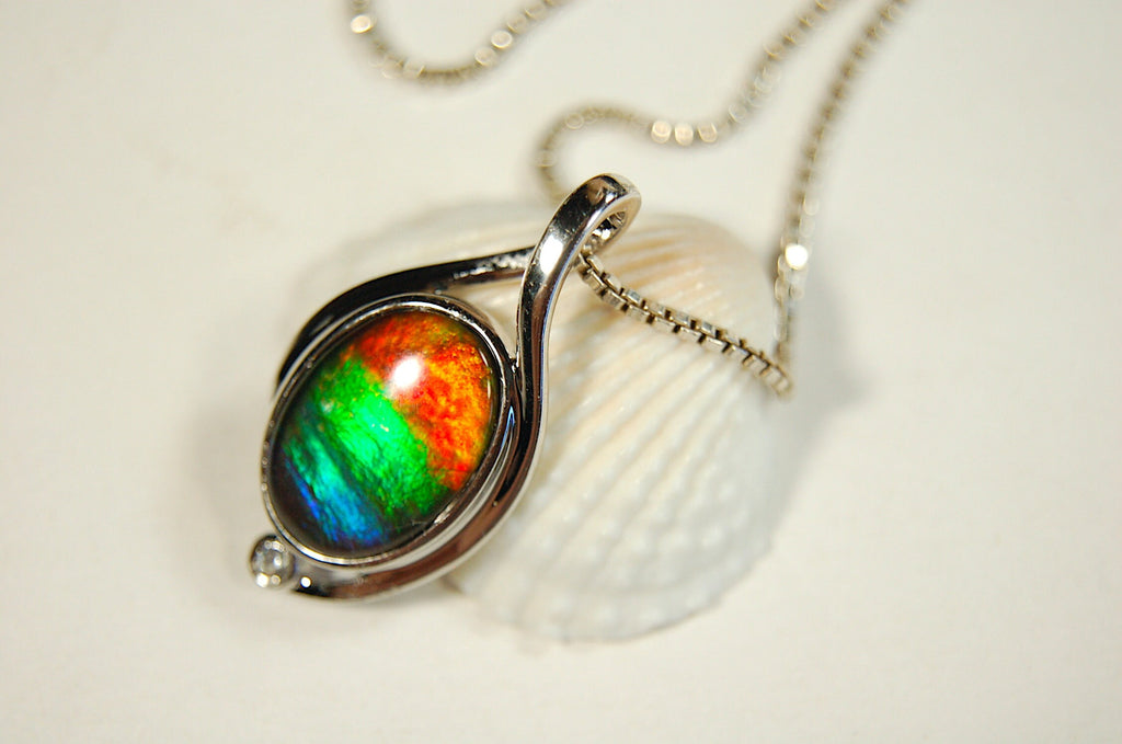 Ammolite Jewelry Pendant.Strong colors.Quality sterling Allergy free silver setting.Shipped free.071612