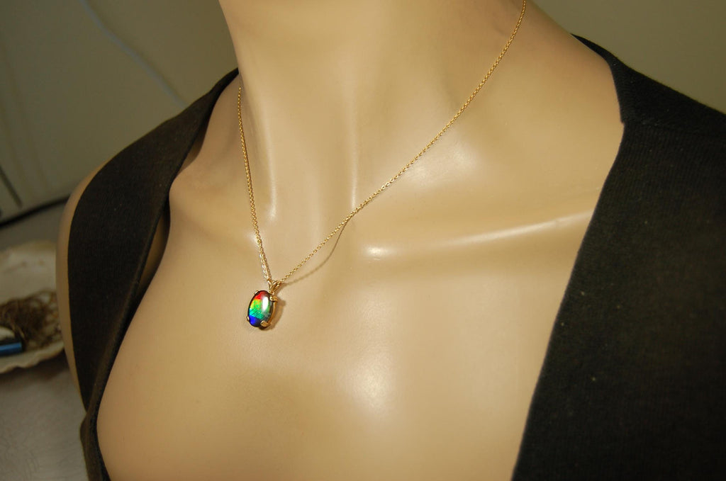 Ammolite necklace pendant in solid 10k yellow gold.A gift your wife will treasure.Brilliant color changer. 071601