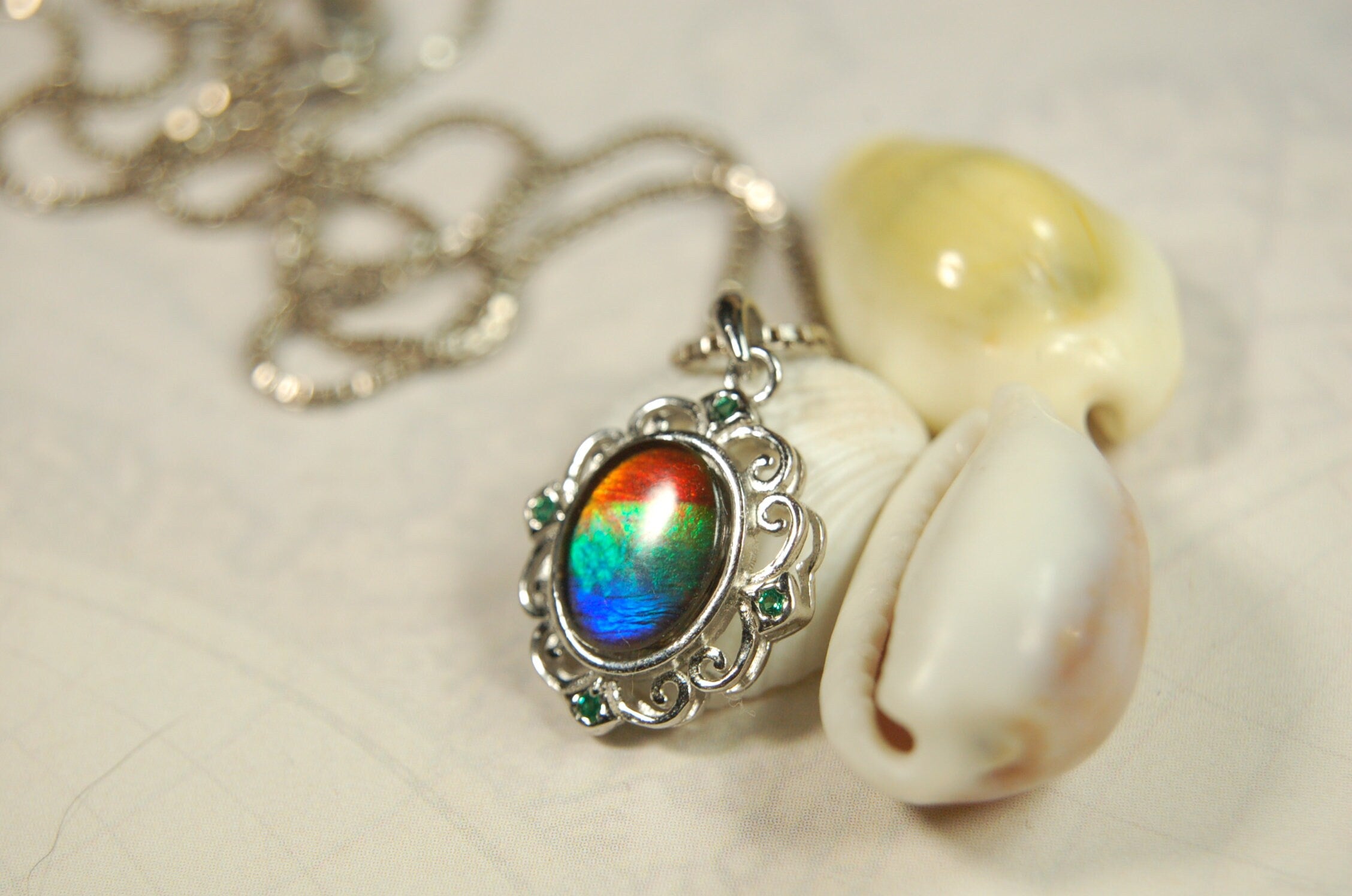 Ammolite Jewelry Pendant.Certified Authentic Canadian gem.White Gold Fill over Sterling silver setting.120213