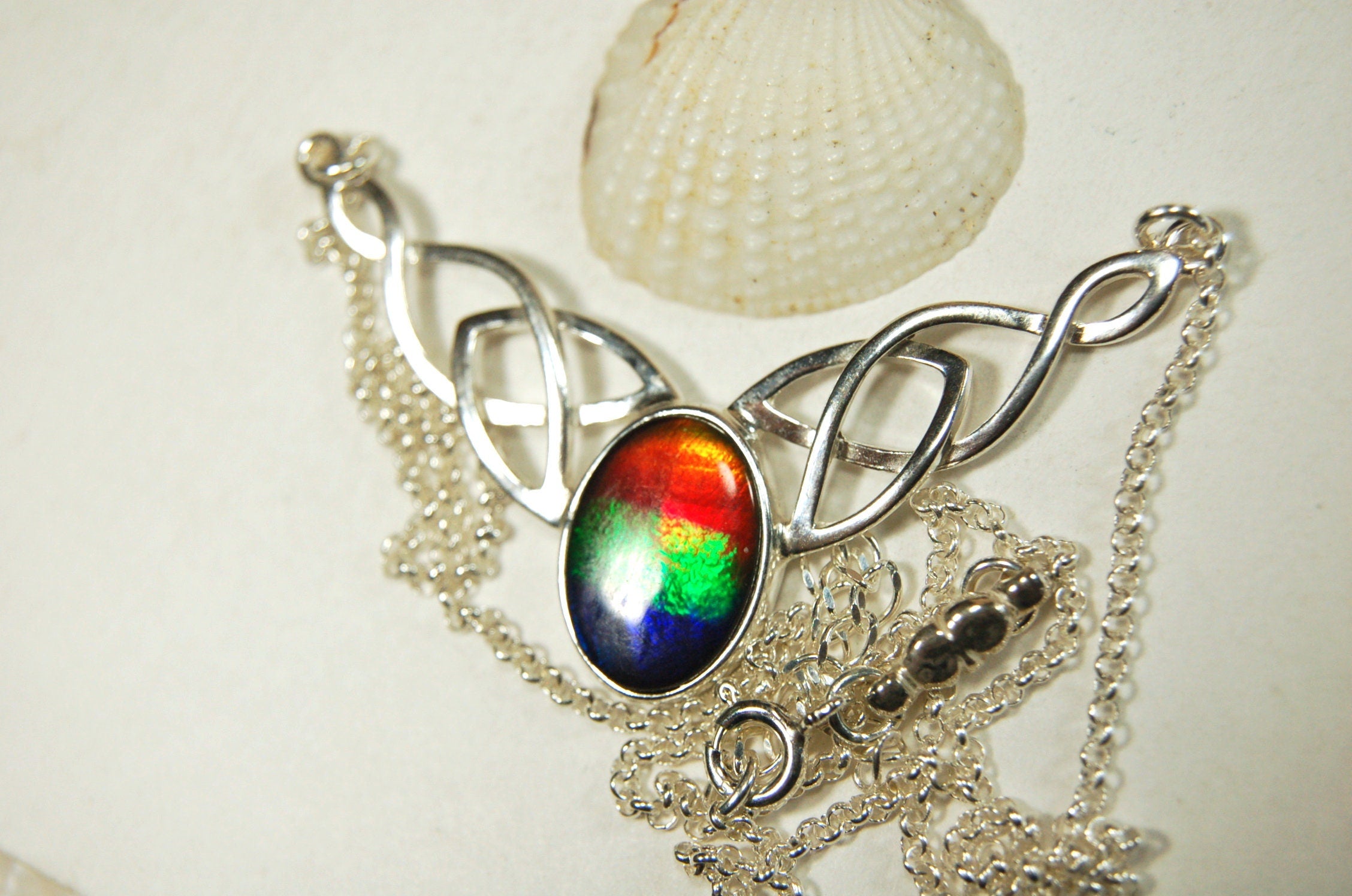 Ammolite Jewelry Necklace of the much admired Rainbow type.Four colors. Lovely Celtic setting with extender.#042513