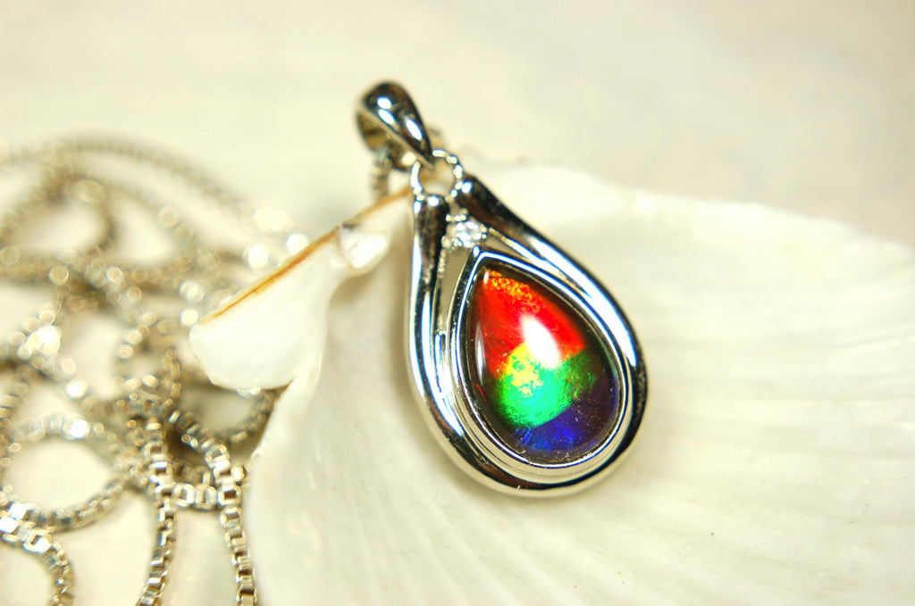 Buy Canadian Ammolite Pendant.Petite but very powerful colors.Perfect gift or gift for wife.Brilliant rainbow colors.Must see video.050429