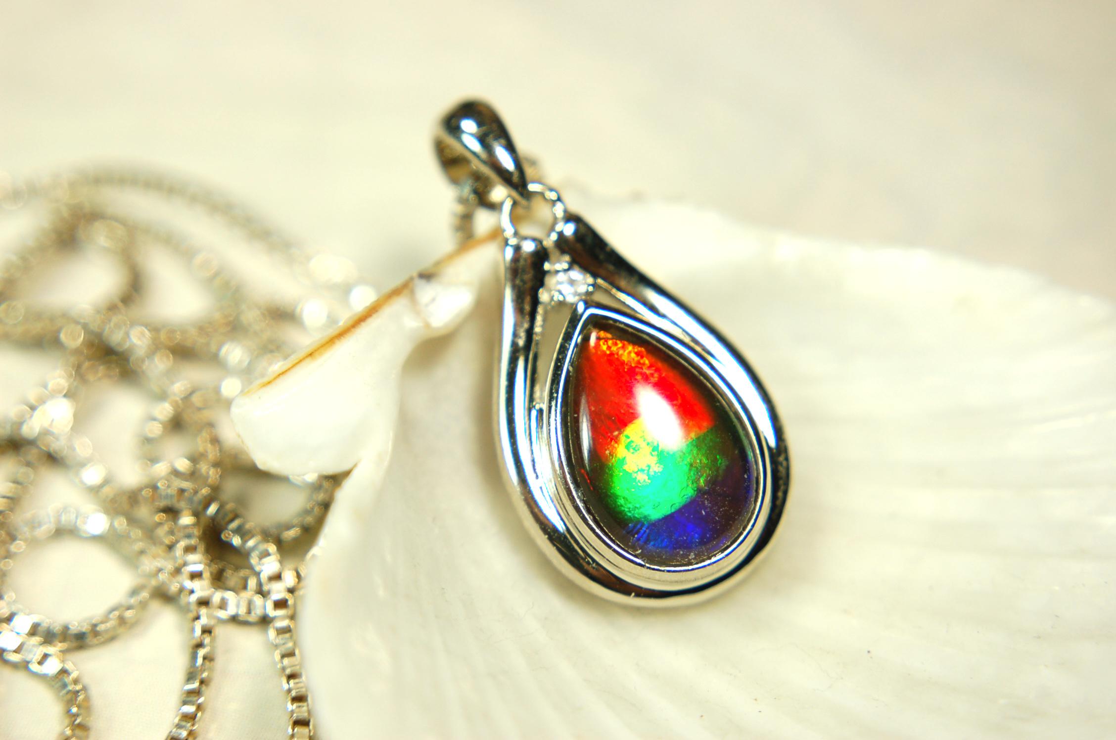 Buy Canadian Ammolite Pendant.Petite but very powerful colors.Perfect gift or gift for wife.Brilliant rainbow colors.Must see video.050429
