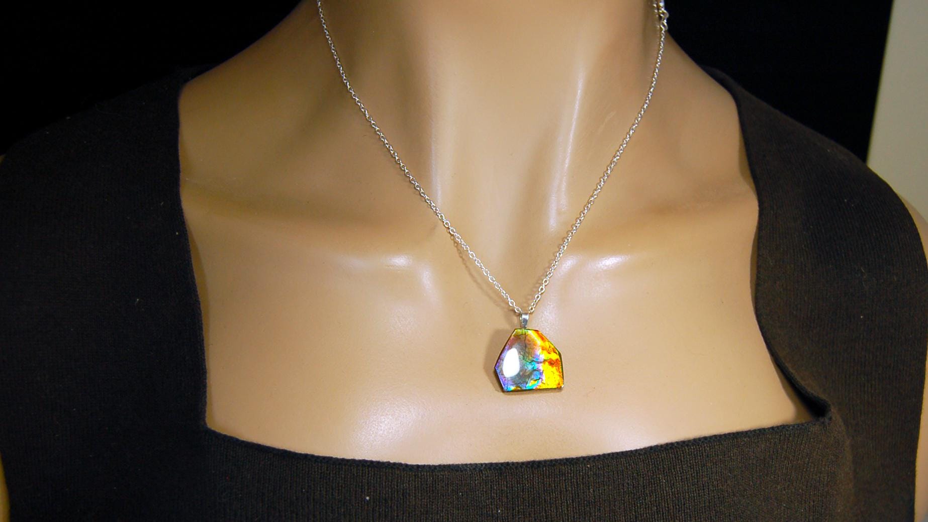 Ammolite pendant.RARE colors.Best seen in video.All natural cabochon from Alberta Canada.Thoughtful gift for her.022716