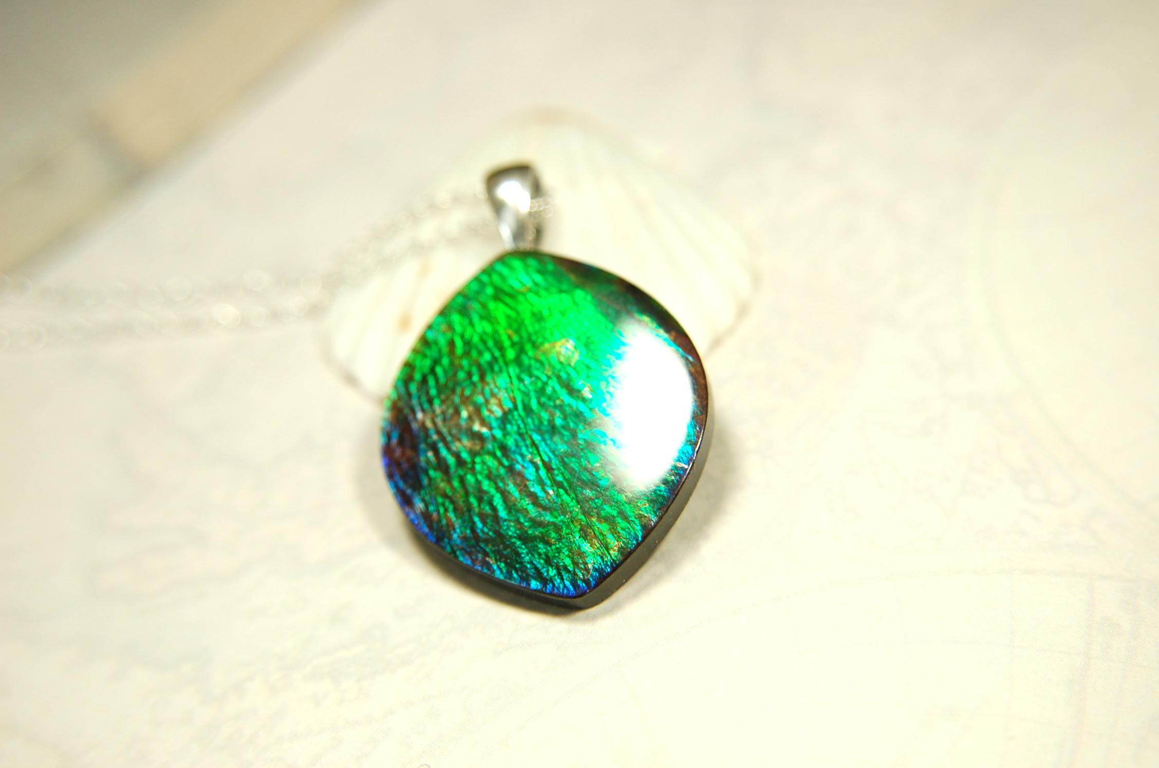 Ammolite pendant for lovers of green this is the one.High quality genuine gem from Alberta Canada.Big impact pendant.021226