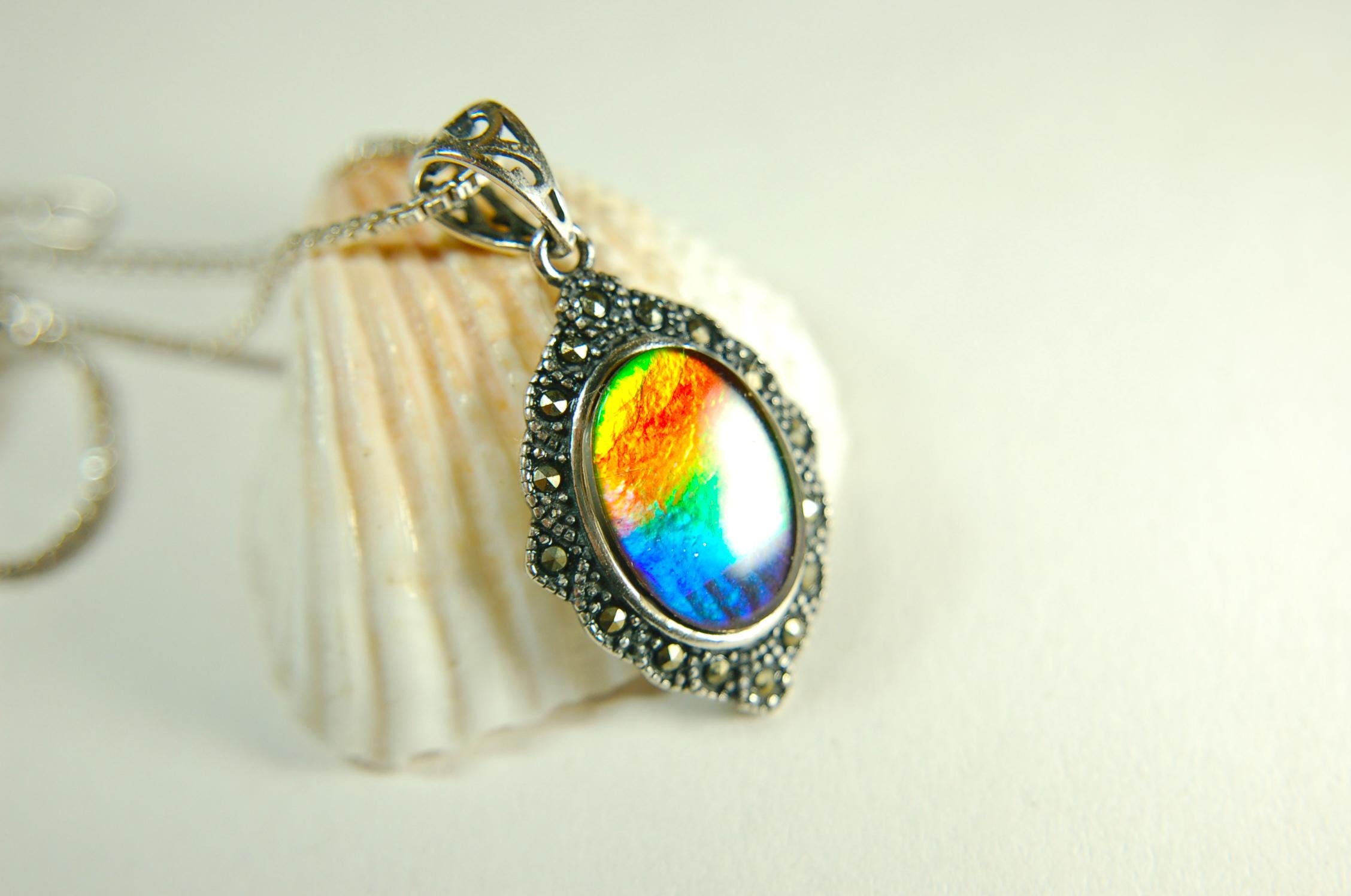 Ammolite jewelry pendant-a wifes birthgay gift Idea she will treasure.Genuine high quality ammolite mined and shipped from Canada.013115