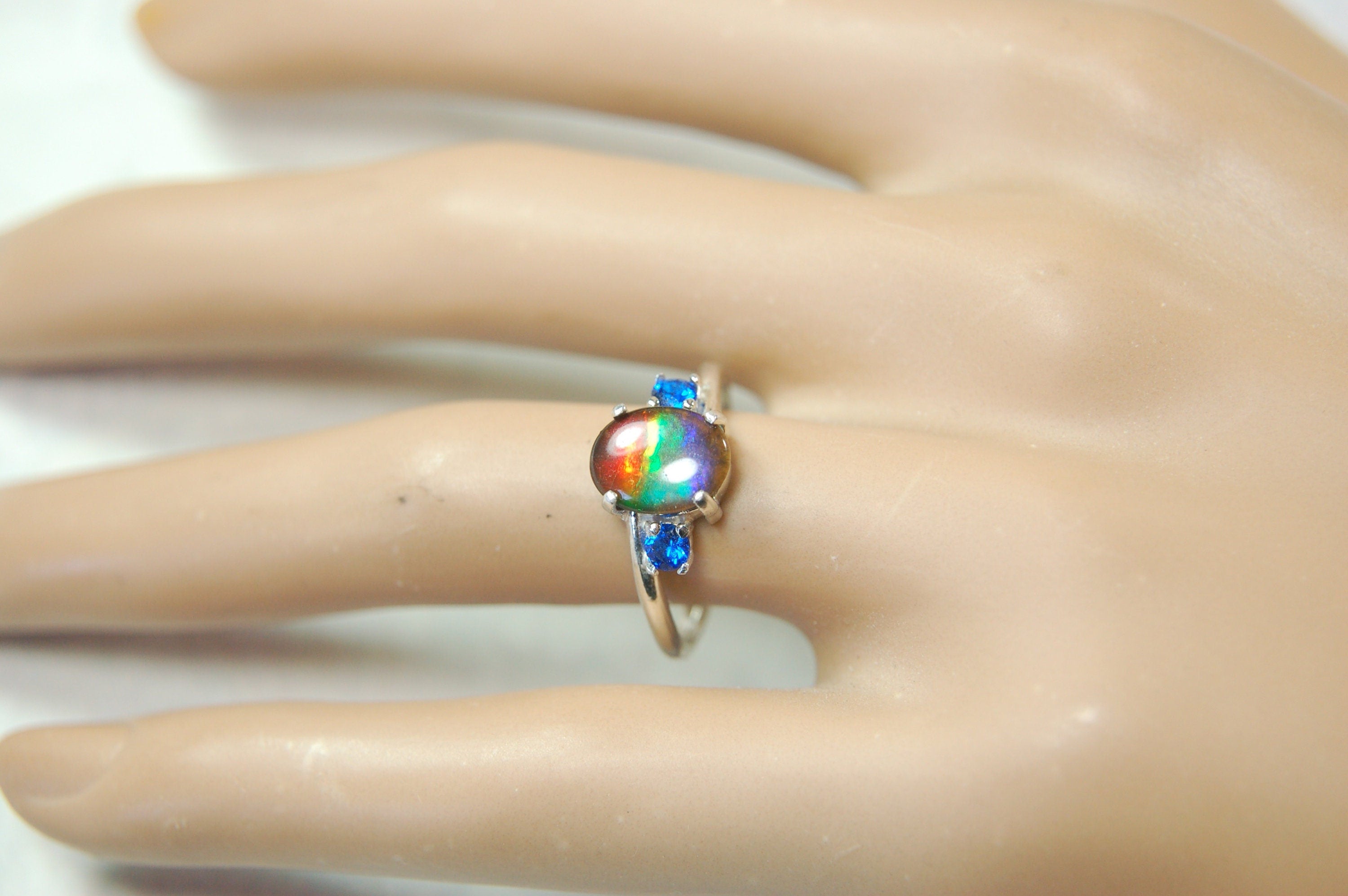 Ammolite Ring with brilliant Spinel side stones.Size 7.
