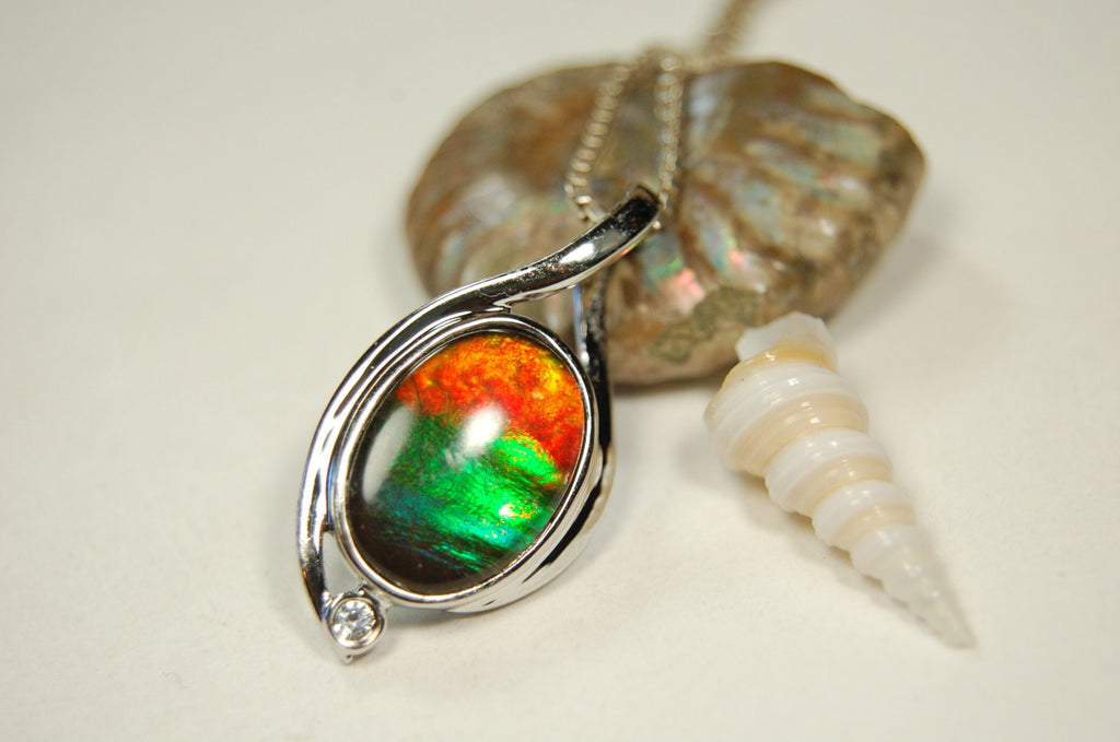 Ammolite Jewelry Pendant.Strong colors.Quality sterling Allergy free silver setting.Shipped free.071612
